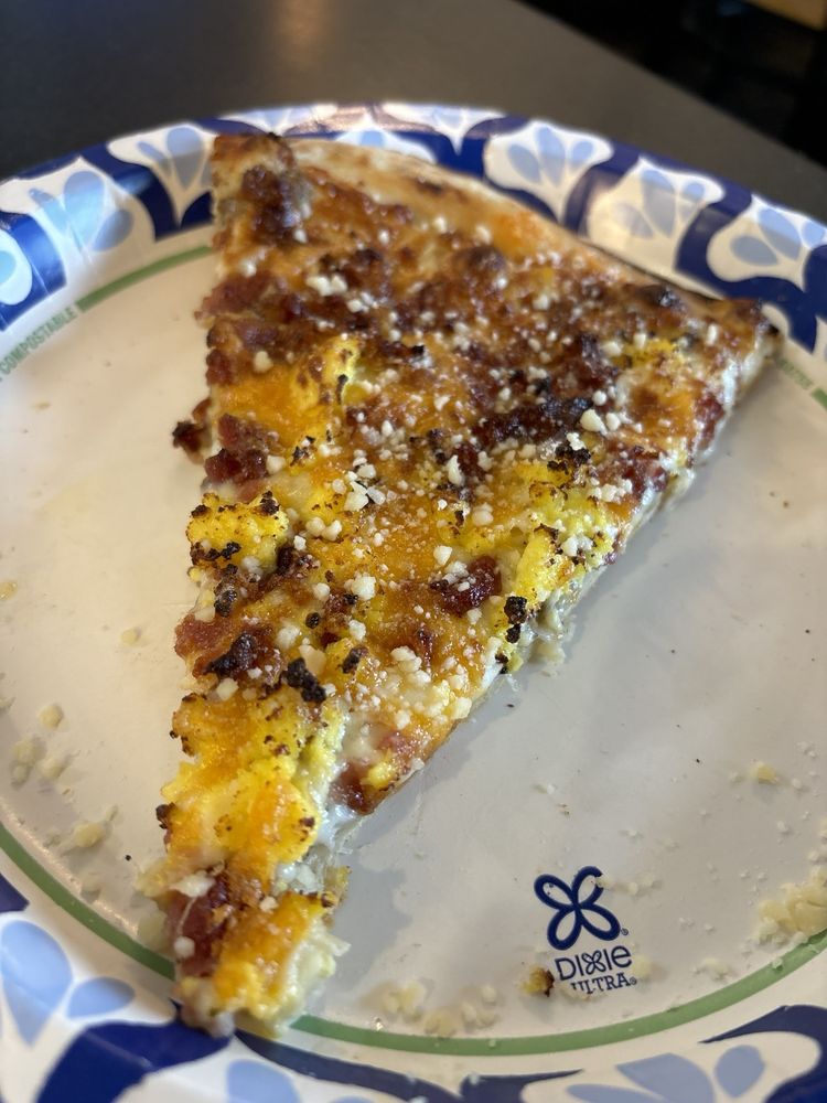 Close up of the legendary Coast Pizza breakfast pie with baked-in eggs and sausage gravy